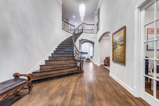 1110 Holford Dr, Frisco, TX 75036 - entryway with stairs, arched walkways, a chandelier, and a towering ceiling