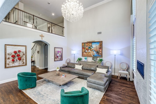 1110 Holford Dr, Frisco, TX 75036 - living area with arched walkways, baseboards, and wood finished floors
