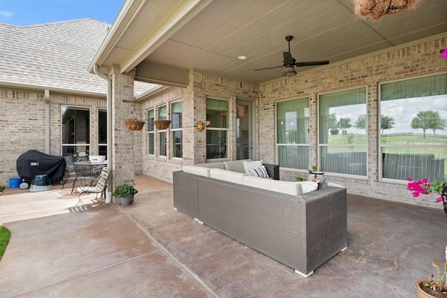 view of patio featuring area for grilling, ceiling fan, and an outdoor hangout area