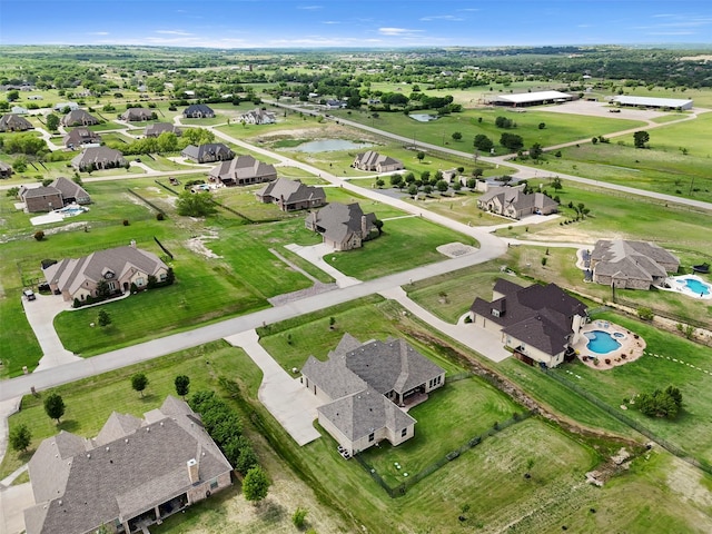 bird's eye view with a water view and a residential view
