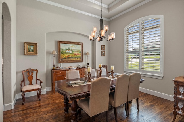 dining area with crown molding, dark wood-style flooring, baseboards, and a chandelier