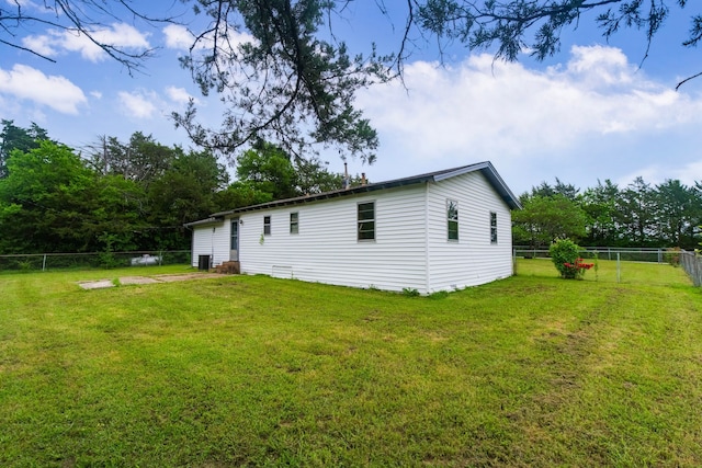 exterior space featuring a yard and a fenced backyard