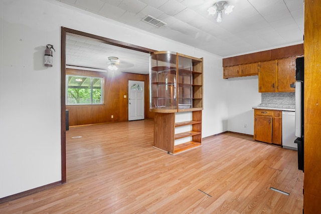 kitchen with brown cabinets, open shelves, baseboards, decorative backsplash, and visible vents