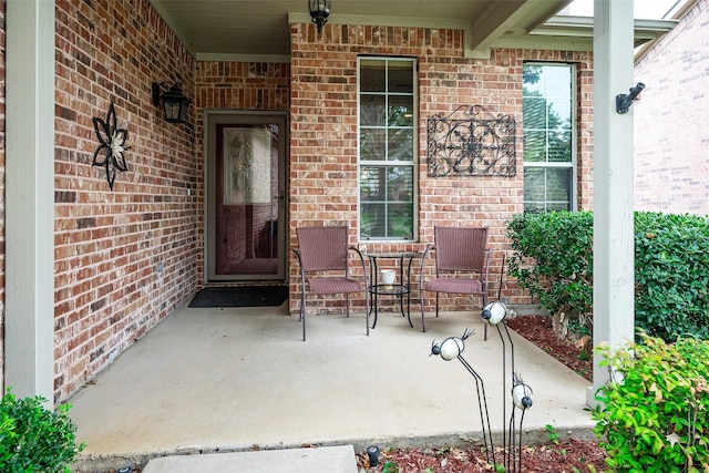 1124 Burnswick Isles Way, Frisco, TX 75036 - doorway to property with brick siding and a porch
