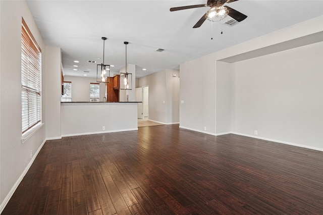 1124 Burnswick Isles Way, Frisco, TX 75036 - unfurnished living room featuring a ceiling fan, dark wood-type flooring, baseboards, and recessed lighting