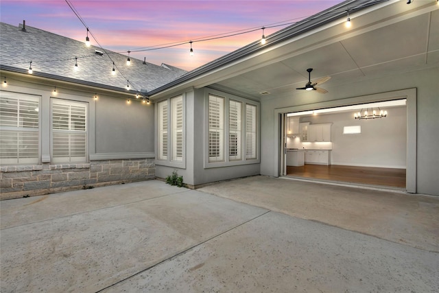 view of patio with concrete driveway and ceiling fan