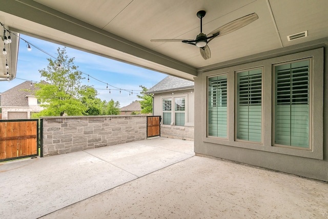 view of patio / terrace featuring visible vents, a gate, a ceiling fan, and fence
