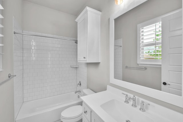 bathroom with vanity, shower / bathtub combination, and toilet