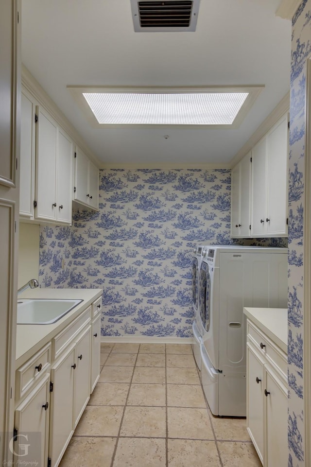 5030 Old Mooringsport Rd, Shreveport, LA 71107 - laundry area featuring cabinet space, independent washer and dryer, a sink, wallpapered walls, and visible vents