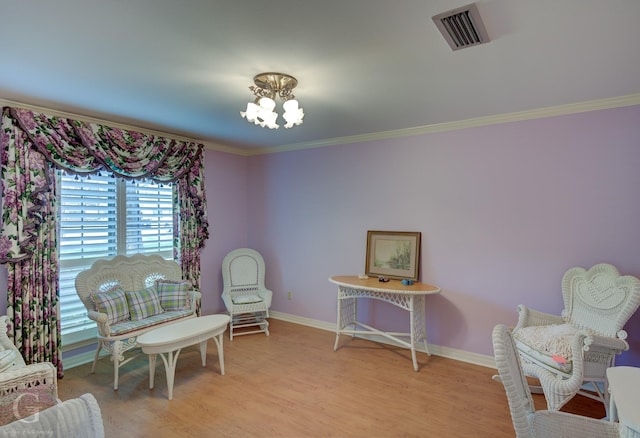 5030 Old Mooringsport Rd, Shreveport, LA 71107 - living area with visible vents, light wood-type flooring, baseboards, an inviting chandelier, and ornamental molding