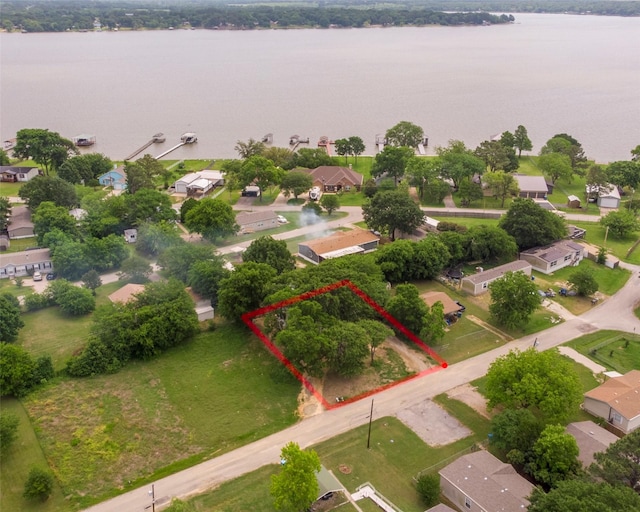 bird's eye view featuring a residential view and a water view