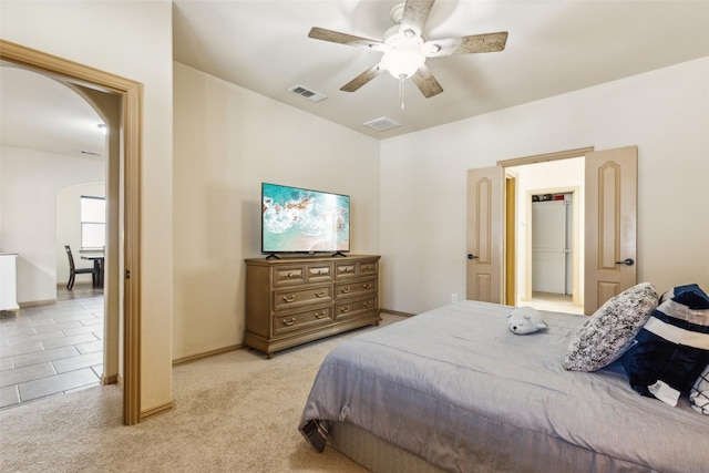 1925 Bridgeport Dr, Providence Village, TX 76227 - bedroom with arched walkways, baseboards, visible vents, and light carpet