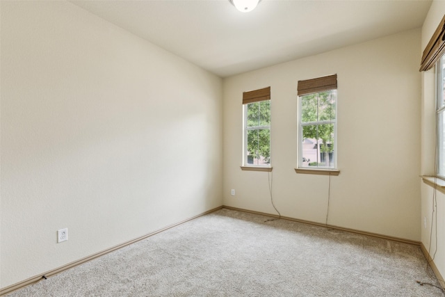 1925 Bridgeport Dr, Providence Village, TX 76227 - spare room featuring baseboards and light carpet