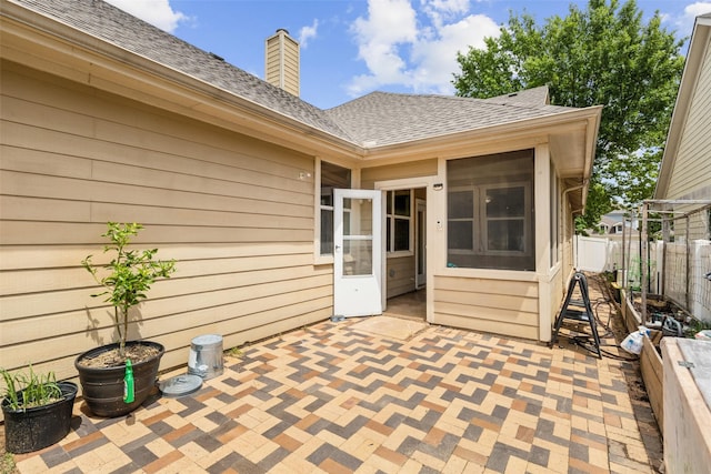 1925 Bridgeport Dr, Providence Village, TX 76227 - view of patio / terrace with a sunroom and fence