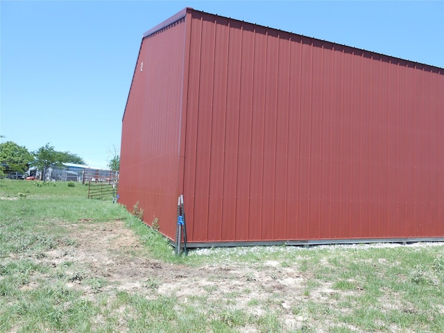 view of pole building featuring fence