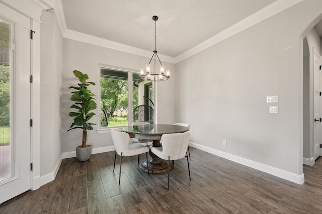 317 Wayward Spur, Springtown, TX 76082 - dining area with arched walkways, a chandelier, dark wood-style floors, baseboards, and crown molding