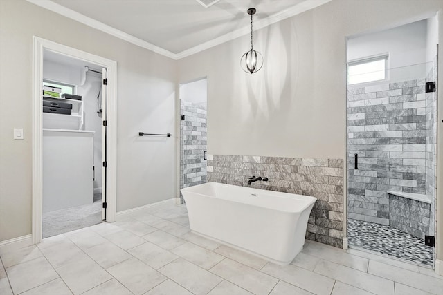 bathroom featuring crown molding, tile walls, a wainscoted wall, a soaking tub, and a shower stall