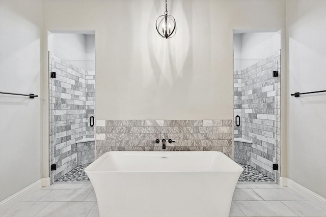 bathroom featuring tile walls, a freestanding bath, and a stall shower