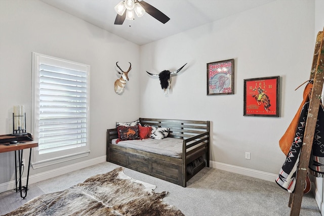 bedroom with carpet floors and baseboards