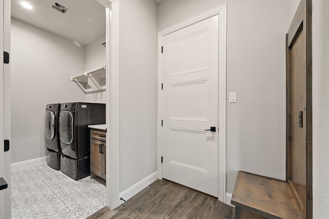 317 Wayward Spur, Springtown, TX 76082 - laundry area with separate washer and dryer, baseboards, and dark wood finished floors