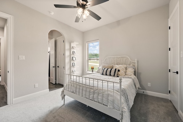 317 Wayward Spur, Springtown, TX 76082 - bedroom with arched walkways, carpet flooring, baseboards, and a ceiling fan