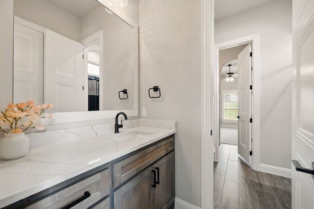 317 Wayward Spur, Springtown, TX 76082 - bathroom featuring vanity, baseboards, ceiling fan, and wood finished floors