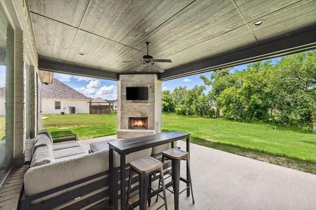 317 Wayward Spur, Springtown, TX 76082 - view of patio featuring ceiling fan and an outdoor living space with a fireplace
