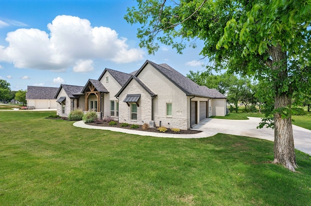 317 Wayward Spur, Springtown, TX 76082 - french country home featuring stone siding, a garage, concrete driveway, and a front lawn