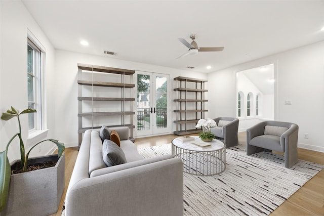 living room with ceiling fan, recessed lighting, baseboards, wood finished floors, and visible vents