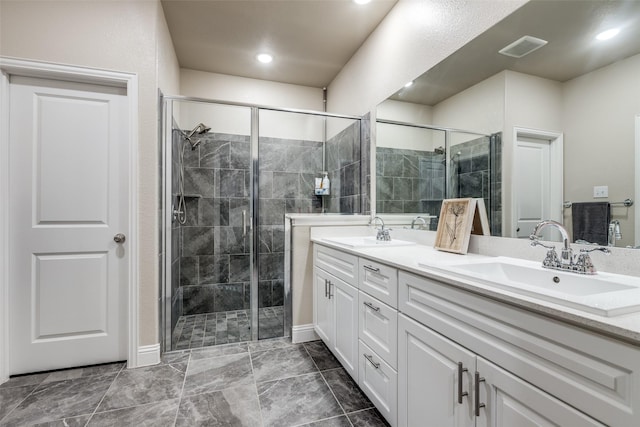 439 Tommie Lillian Ln, Celina, TX 75009 - full bath featuring a stall shower, double vanity, and a sink