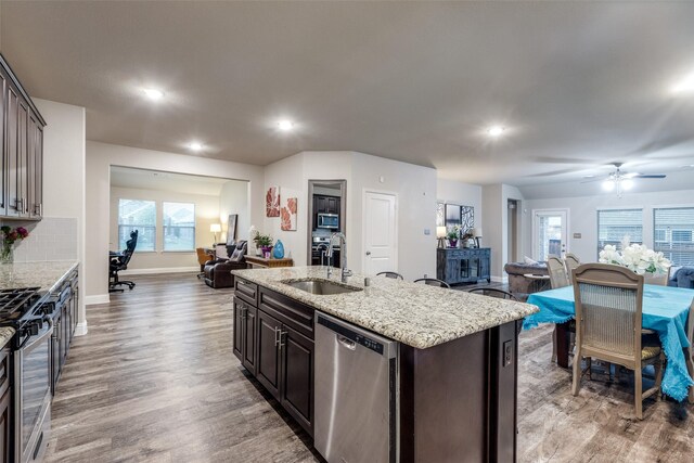 439 Tommie Lillian Ln, Celina, TX 75009 - kitchen featuring a sink, light wood-type flooring, recessed lighting, open floor plan, and appliances with stainless steel finishes