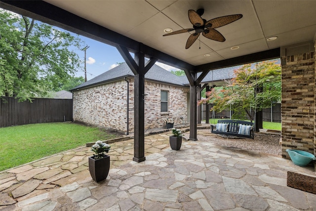 view of patio featuring ceiling fan and a fenced backyard