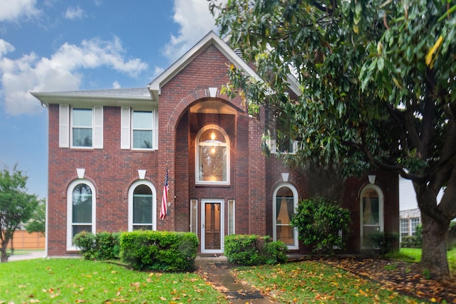 7208 Stoddard Ln, Plano, TX 75025 - view of front of home with brick siding and a front yard