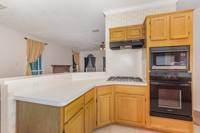 7208 Stoddard Ln, Plano, TX 75025 - kitchen with oven, stainless steel gas cooktop, built in microwave, a peninsula, and under cabinet range hood