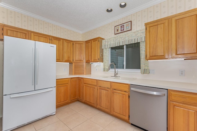7208 Stoddard Ln, Plano, TX 75025 - kitchen with a sink, freestanding refrigerator, wallpapered walls, and dishwasher