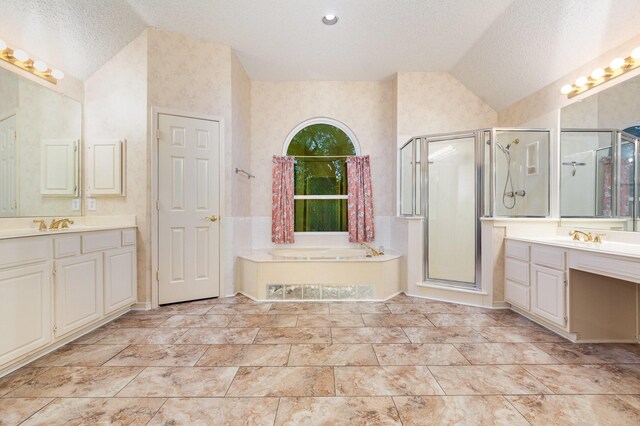 7208 Stoddard Ln, Plano, TX 75025 - bathroom featuring a bath, a textured ceiling, a stall shower, two vanities, and lofted ceiling