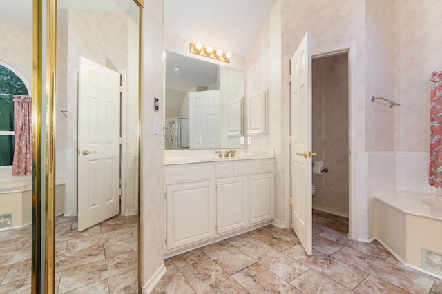 7208 Stoddard Ln, Plano, TX 75025 - bathroom featuring vanity, toilet, wallpapered walls, a shower stall, and a bath