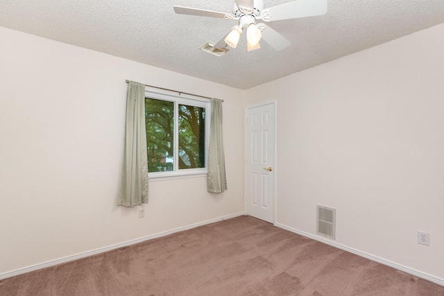 7208 Stoddard Ln, Plano, TX 75025 - spare room with carpet floors, baseboards, a textured ceiling, and visible vents