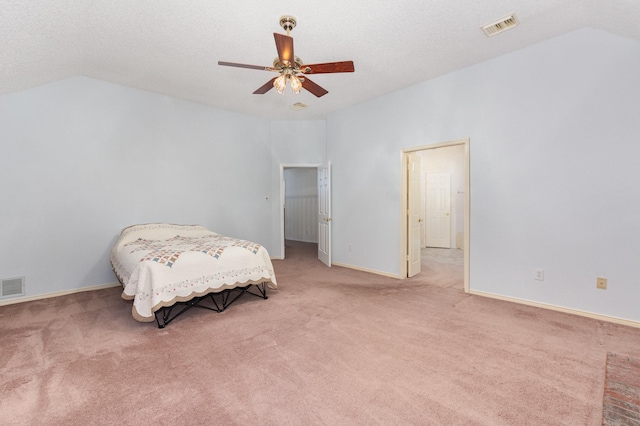 7208 Stoddard Ln, Plano, TX 75025 - bedroom with light colored carpet, lofted ceiling, and visible vents