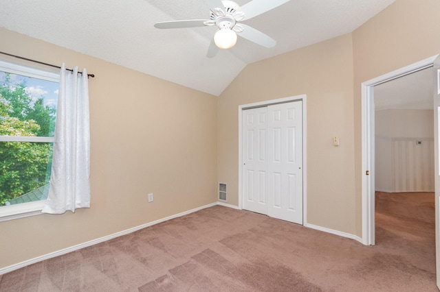 7208 Stoddard Ln, Plano, TX 75025 - unfurnished bedroom with a closet, carpet flooring, baseboards, and lofted ceiling