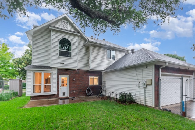 7208 Stoddard Ln, Plano, TX 75025 - back of house with a lawn, brick siding, fence, and a garage