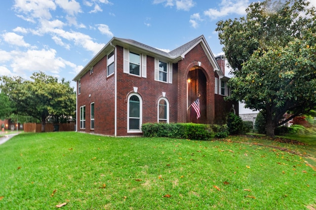 7208 Stoddard Ln, Plano, TX 75025 - traditional-style home featuring a front lawn and brick siding
