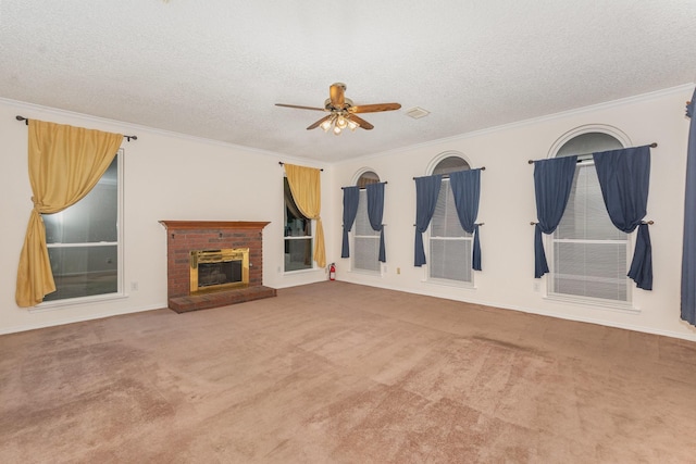 7208 Stoddard Ln, Plano, TX 75025 - unfurnished living room featuring a fireplace, a textured ceiling, carpet, a ceiling fan, and ornamental molding