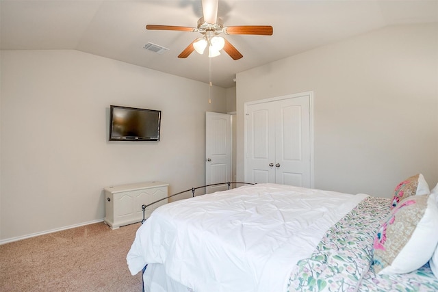 bedroom featuring visible vents, lofted ceiling, light carpet, baseboards, and a ceiling fan