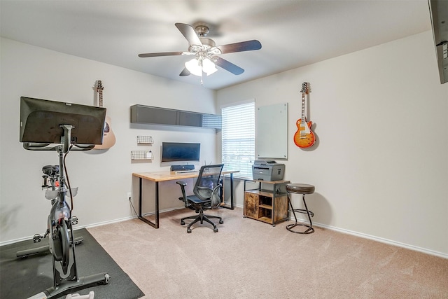office area with carpet floors, baseboards, and a ceiling fan