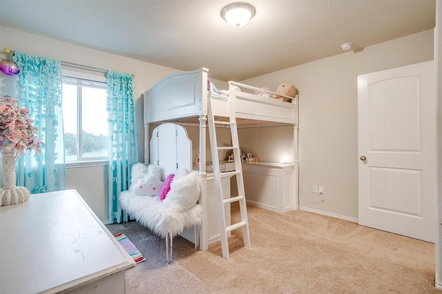 bedroom featuring light carpet