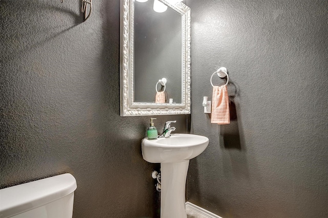 bathroom featuring toilet