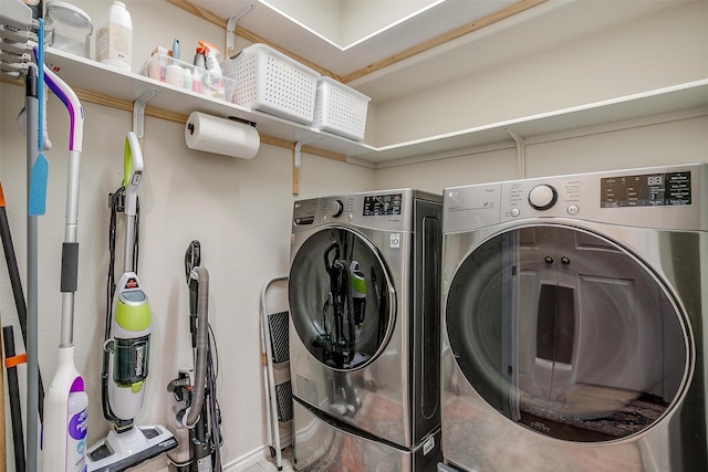 clothes washing area featuring laundry area and washer and dryer