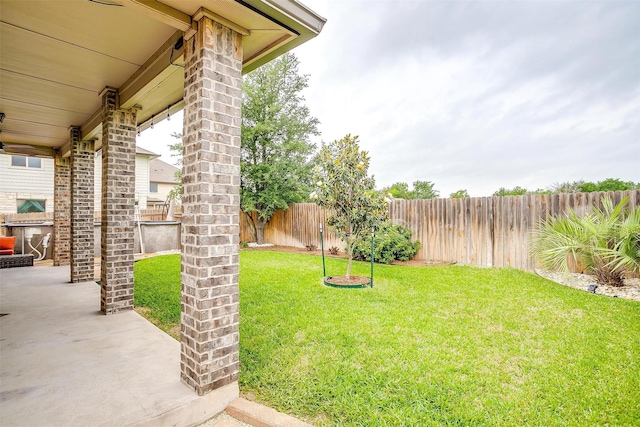view of yard with a fenced backyard and a patio area
