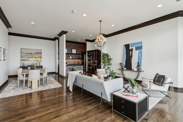 living area featuring recessed lighting, a chandelier, ornamental molding, and wood finished floors